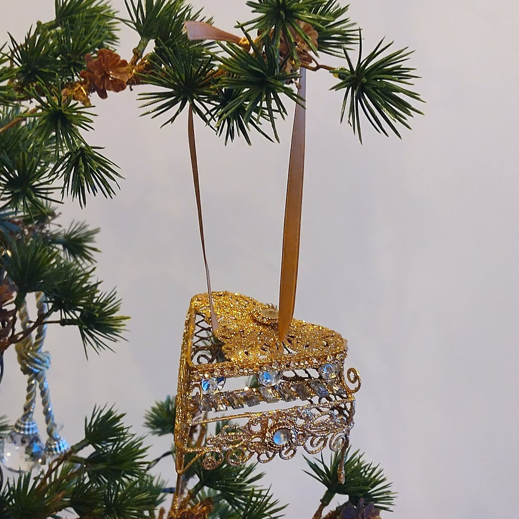 Guld-glimmer piano juleophæng
